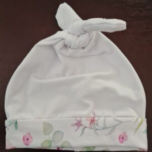 Pink, floral trim Top knot hat