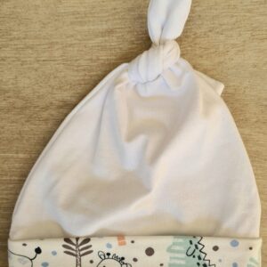 white hat with blue animal trim